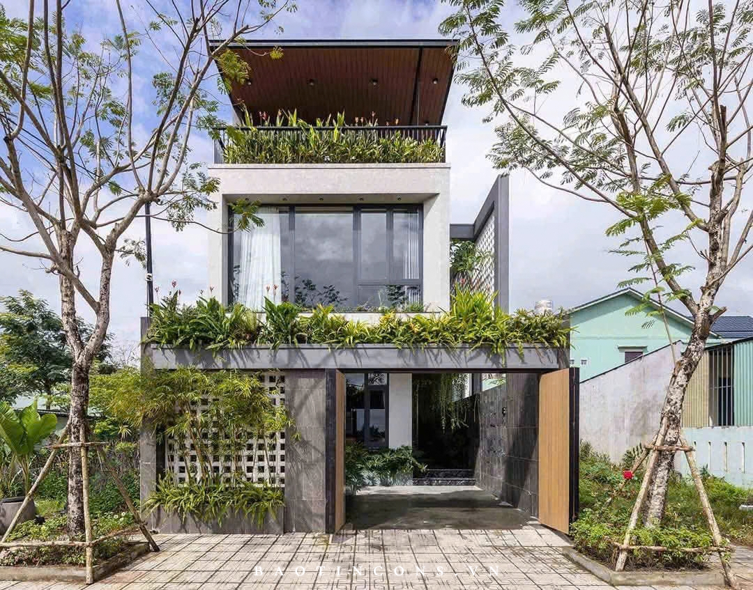Mặt tiền công trình với hình khối hiện đại và những tầng cây xanh đan xen